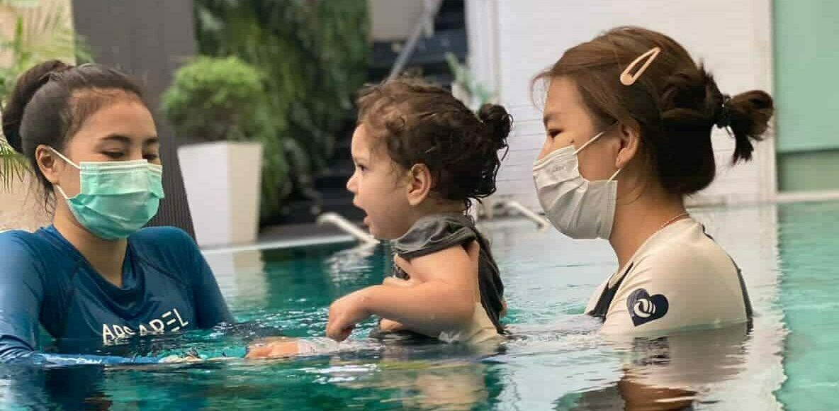 Young child with Spina Bifida swimming